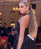 Latin dancer in black dress with earrings and headband